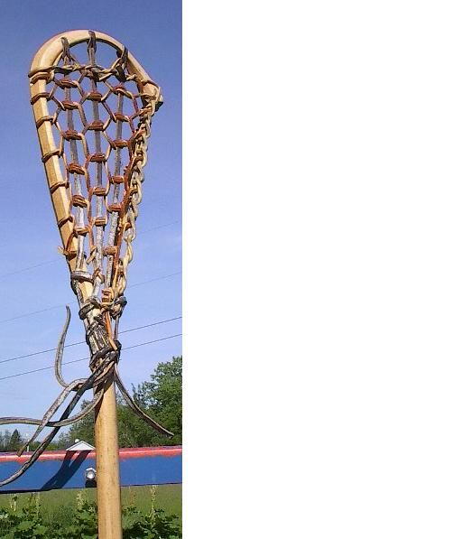 vintage wooden lacrosse stick. Measures 42 long. Signed on the stick